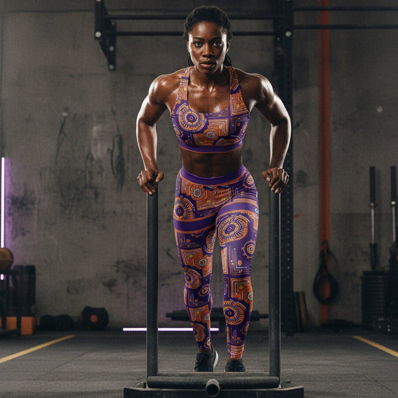 Sankofa women's sports bra and leggings set — Afrofuturist heritage compression — royal purple gear-and-circuit geometry — image 3 — SunBorn alternate