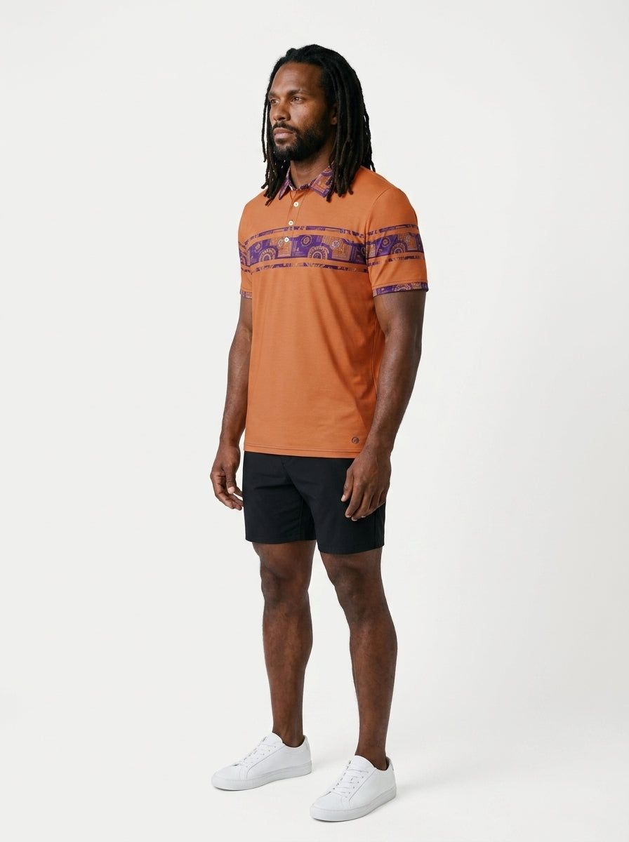 Sankofa Men's Polo — Sango Orange — three-quarter left angle — golf and lifestyle shirt — SunBorn