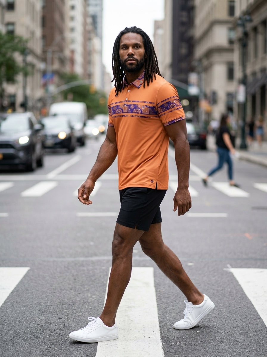 Sankofa Men's Polo — Sango Orange — street editorial lifestyle shot — men's fashion polo — SunBorn