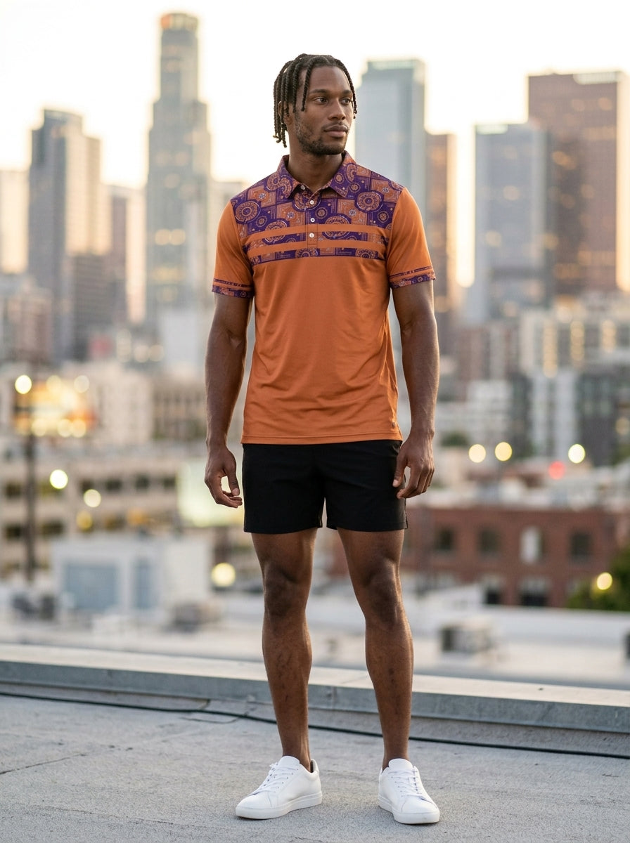 Sankofa Men's Pulse Polo in Sango Orange worn in street-style editorial setting