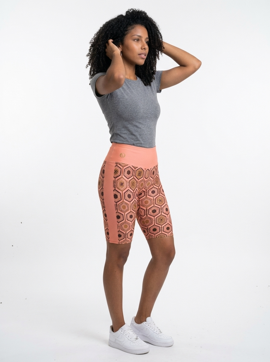 AnanseNova™ Biker Shorts in Adaeze Pink, three-quarter right view on model — SunBorn