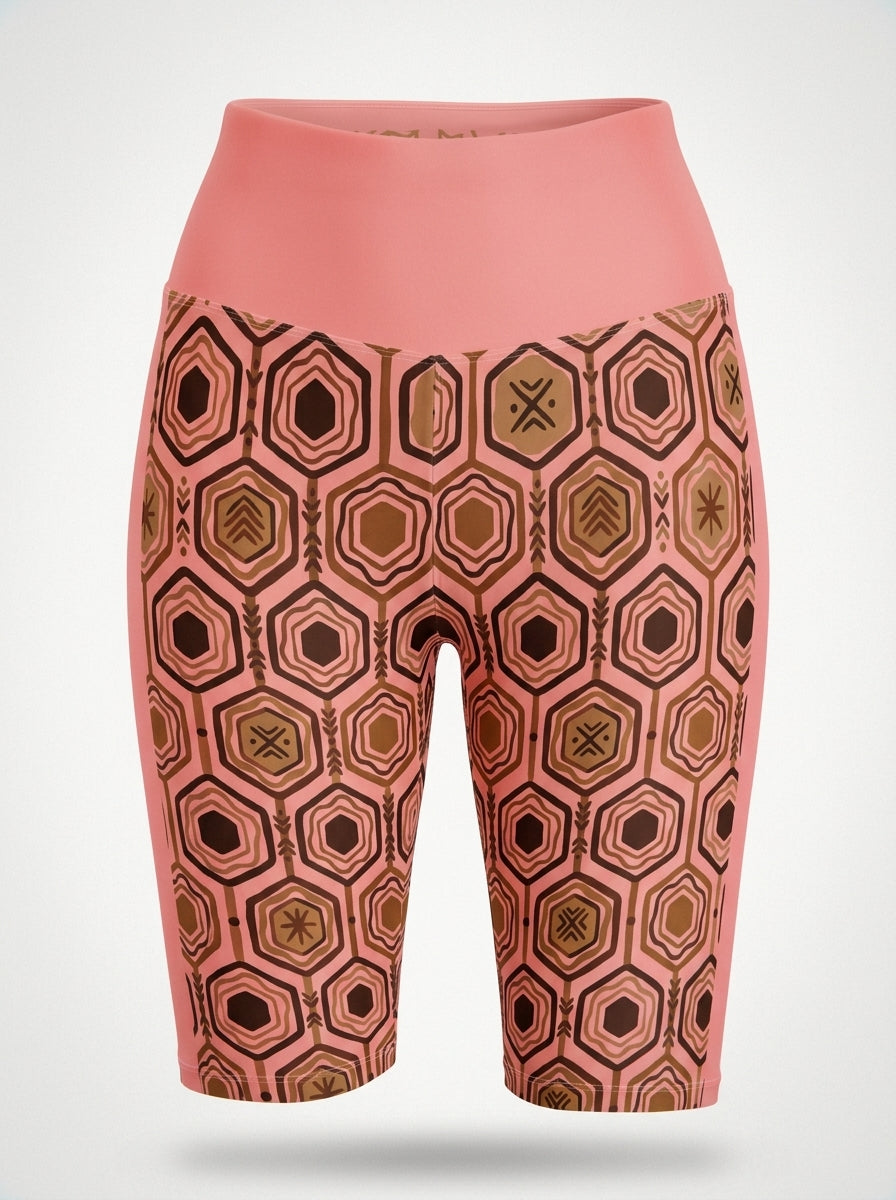 AnanseNova™ Biker Shorts in Adaeze Pink, ghost mannequin front view showing the hexagon print and high waistband — SunBorn