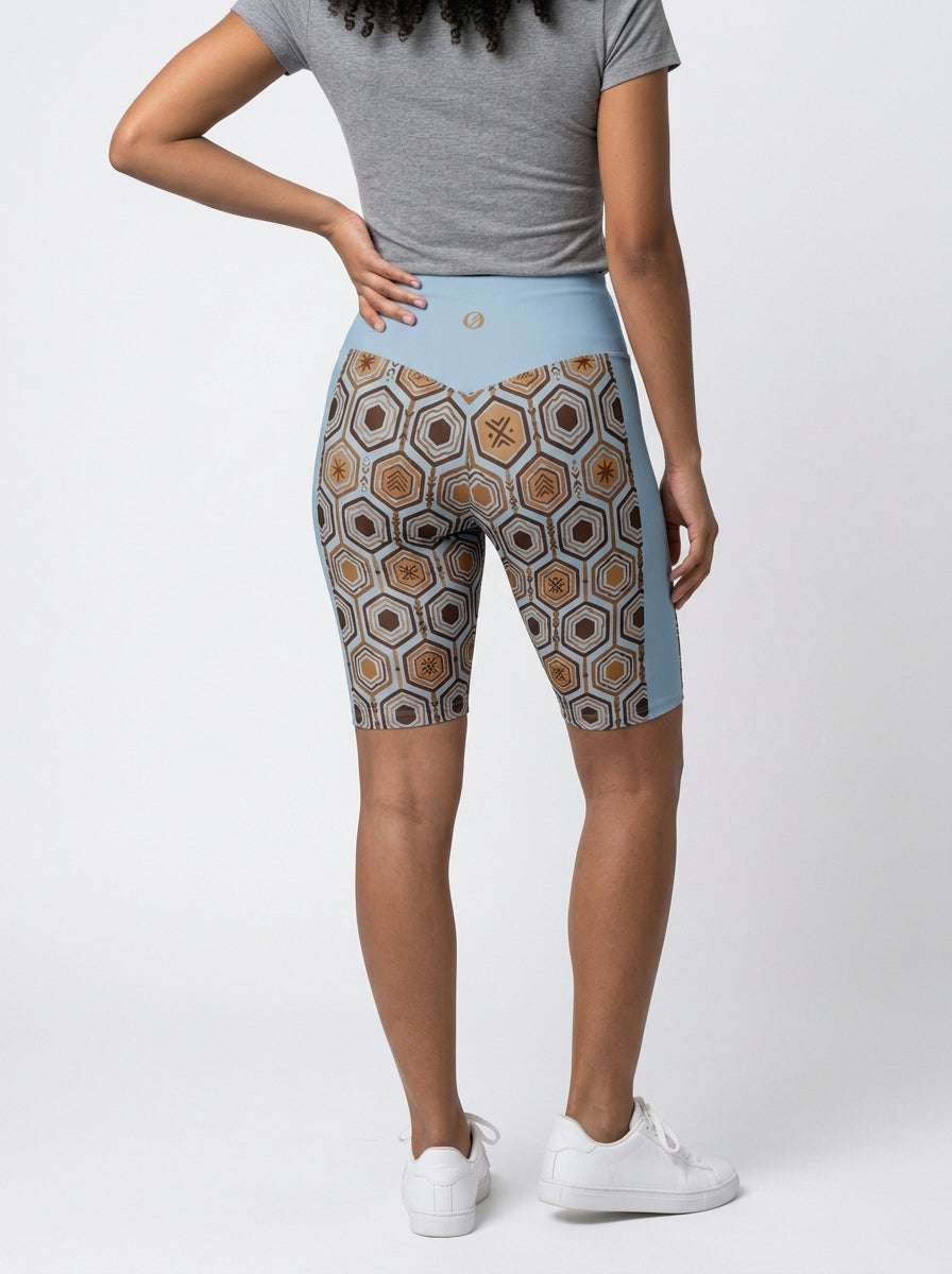 AnanseNova™ Biker Shorts in Igwe Blue, studio back view — SunBorn