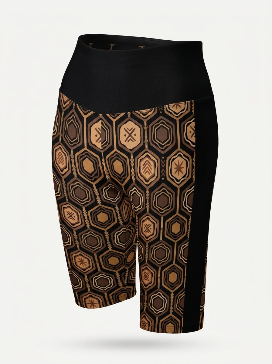 AnanseNova™ Biker Shorts in Oji Black, ghost mannequin three-quarter view showing the solid black side panel — SunBorn