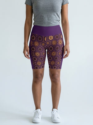 AnanseNova™ Biker Shorts in Ugo Purple with hexagon web-cell print, studio front view — SunBorn