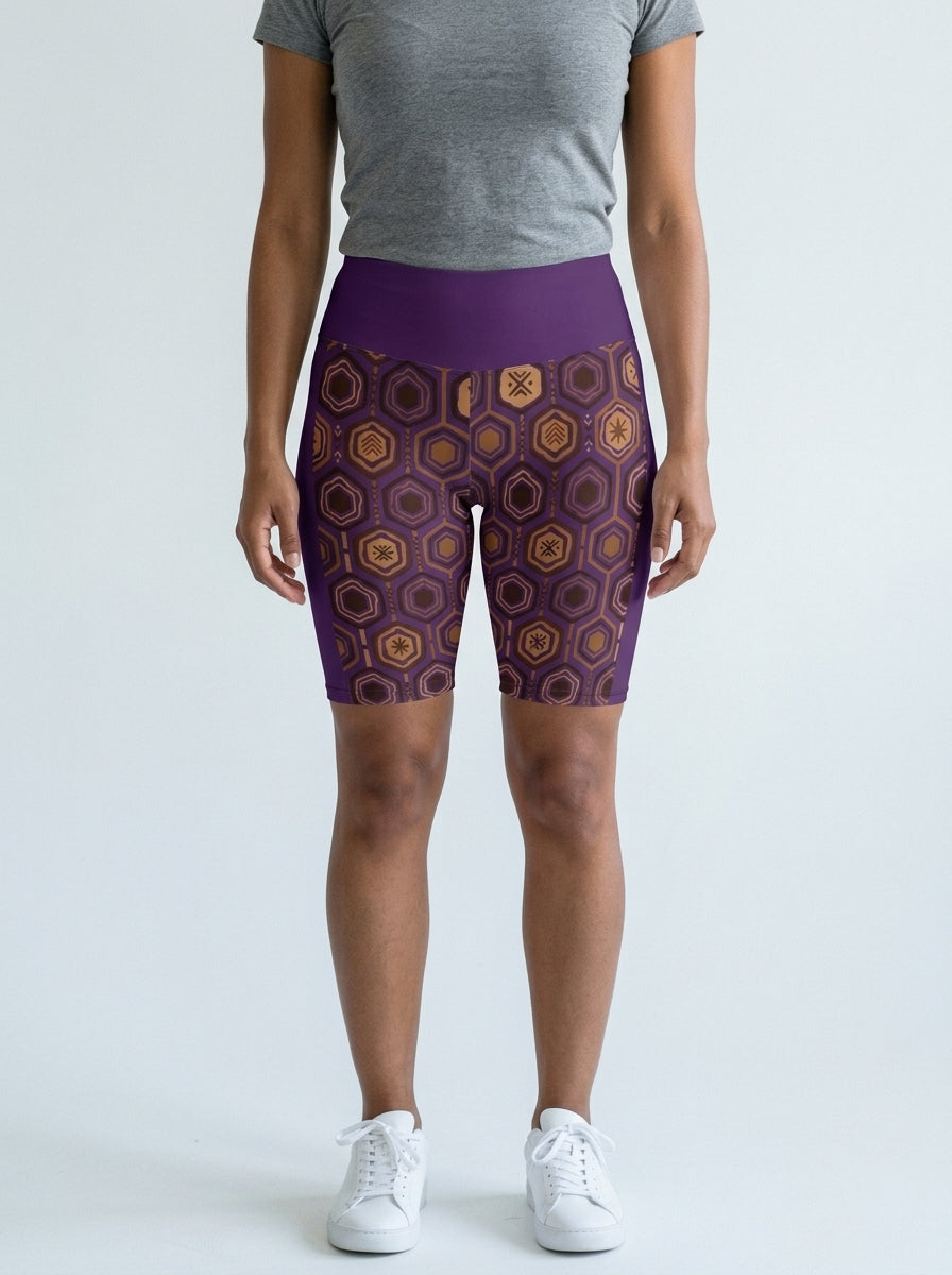 AnanseNova™ Biker Shorts in Ugo Purple with hexagon web-cell print, studio front view — SunBorn