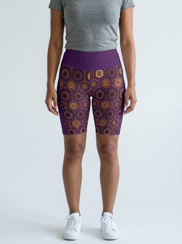 AnanseNova™ Biker Shorts in Ugo Purple with hexagon web-cell print, studio front view — SunBorn