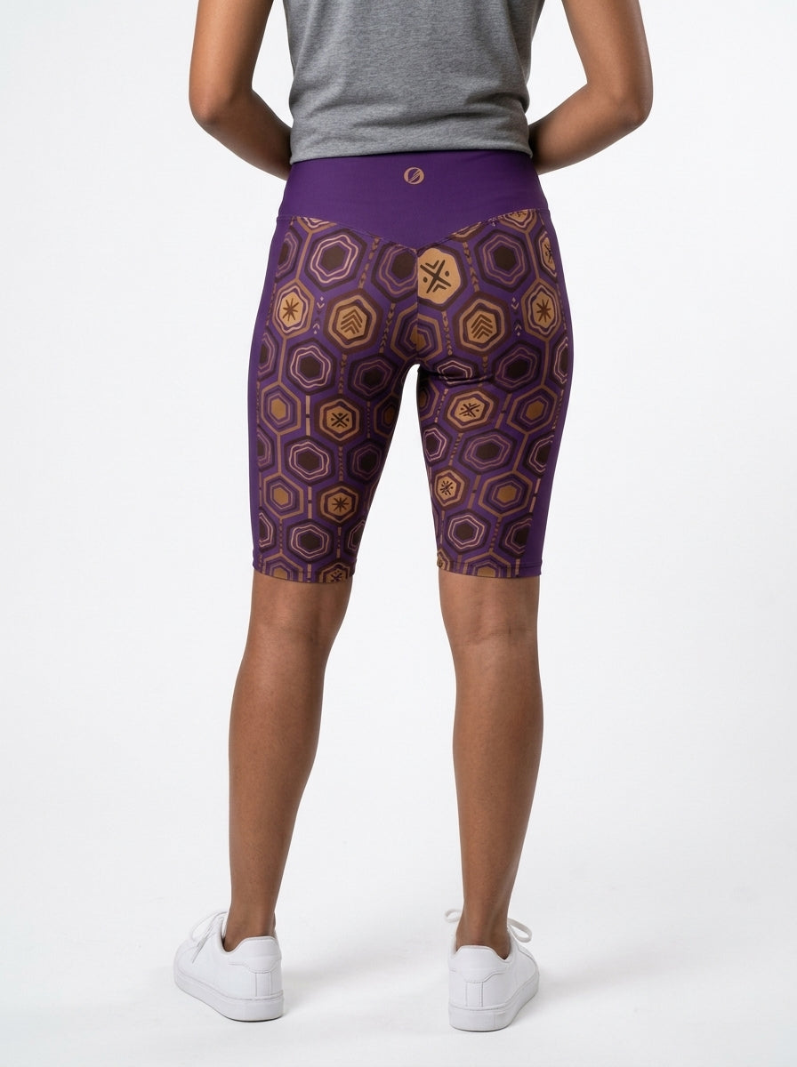 AnanseNova™ Biker Shorts in Ugo Purple, studio back view — SunBorn