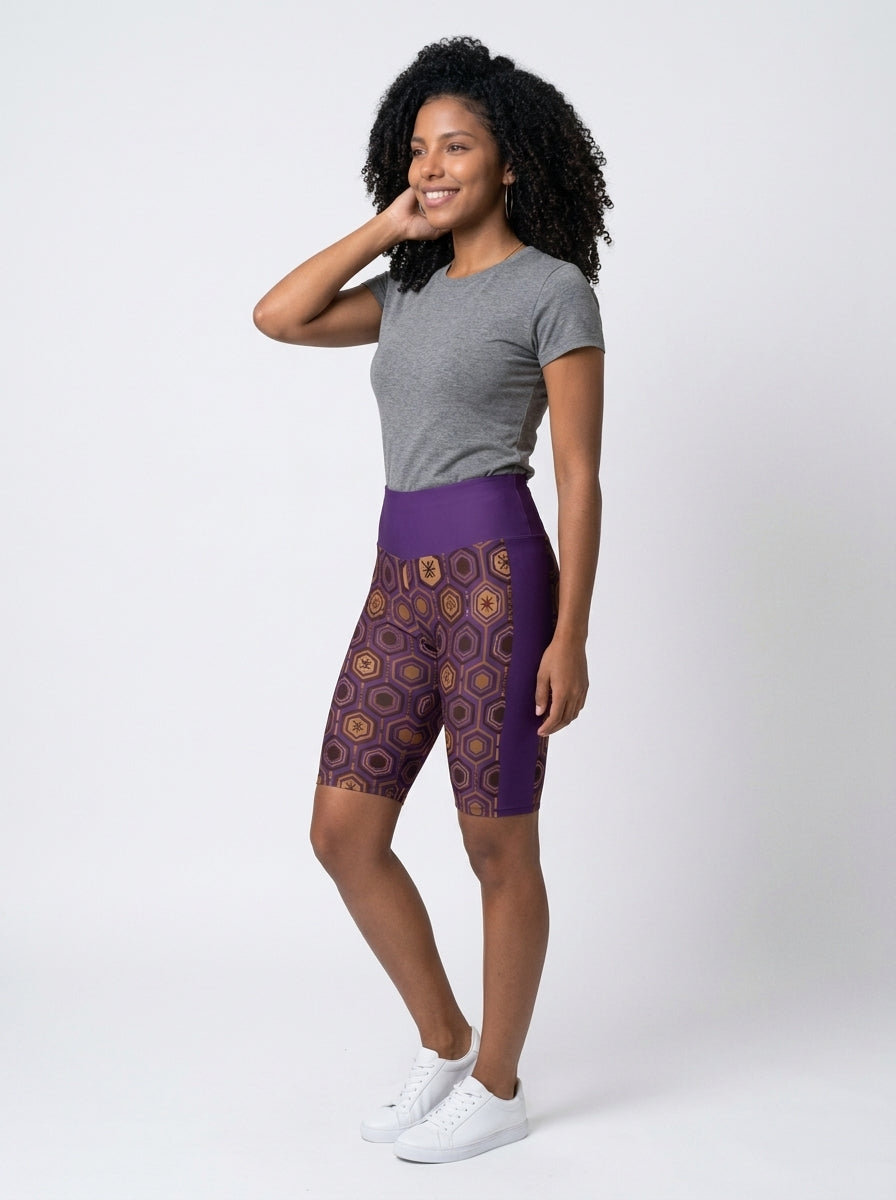 AnanseNova™ Biker Shorts in Ugo Purple, three-quarter left view on model — SunBorn