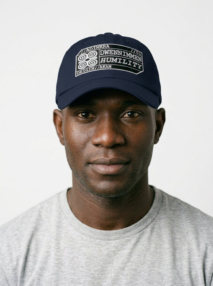Adinkra Humility Dad Hat in Anụnụ Blue — worn front view, embroidered Dwennimmen badge