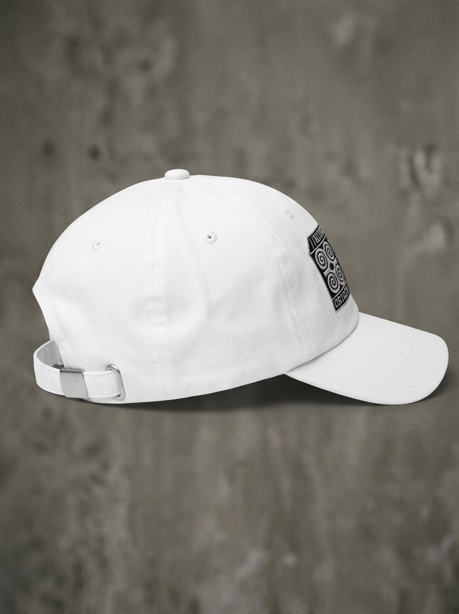 Adinkra Humility Dad Hat in Ocha White — three-quarter left angle