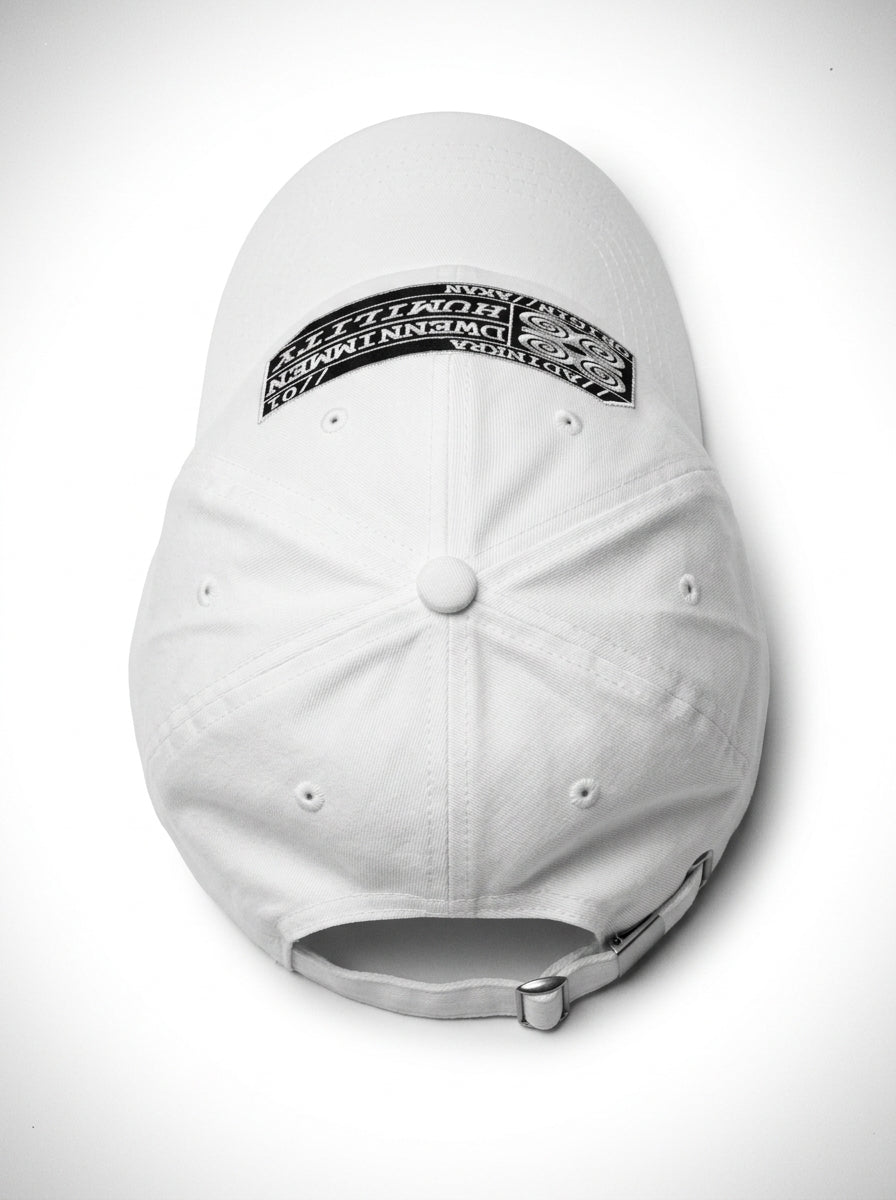Adinkra Humility Dad Hat in Ocha White — crown, top-down view