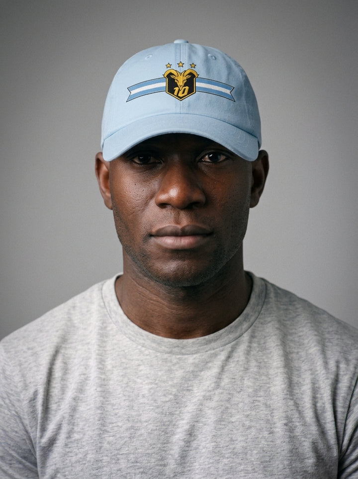 GOAT Celeste Dad Hat in Igwe Blue, worn front — low-profile six-panel cotton-twill cap.