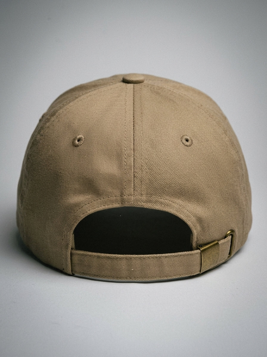 GOAT Celeste Dad Hat in Aja Sand, rear view with adjustable antique-buckle strap.