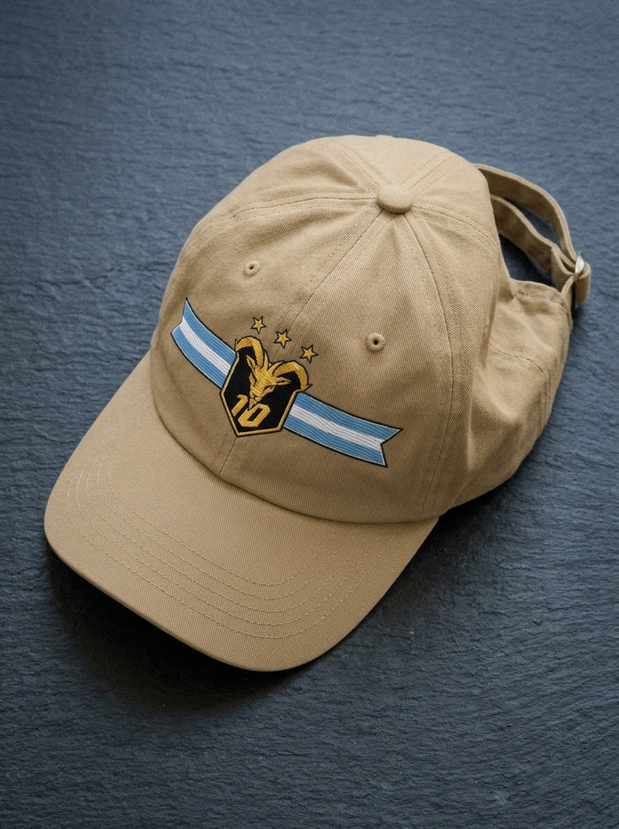 GOAT Celeste Dad Hat in Aja Sand, styled flat lay.