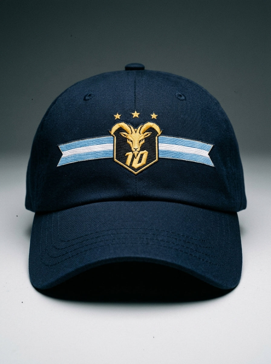 GOAT Celeste Dad Hat in Anụnụ Blue, front view — gold goat crest with N°10 and three stars on an Albiceleste ribbon.