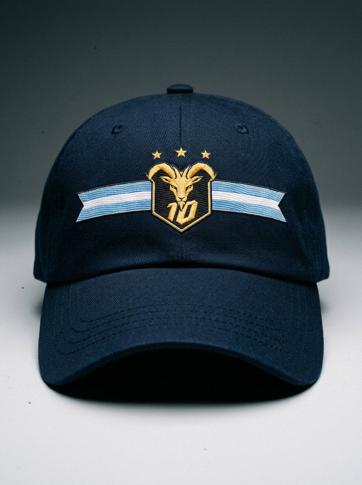 GOAT Celeste Dad Hat in Anụnụ Blue, front view — gold goat crest with N°10 and three stars on an Albiceleste ribbon.