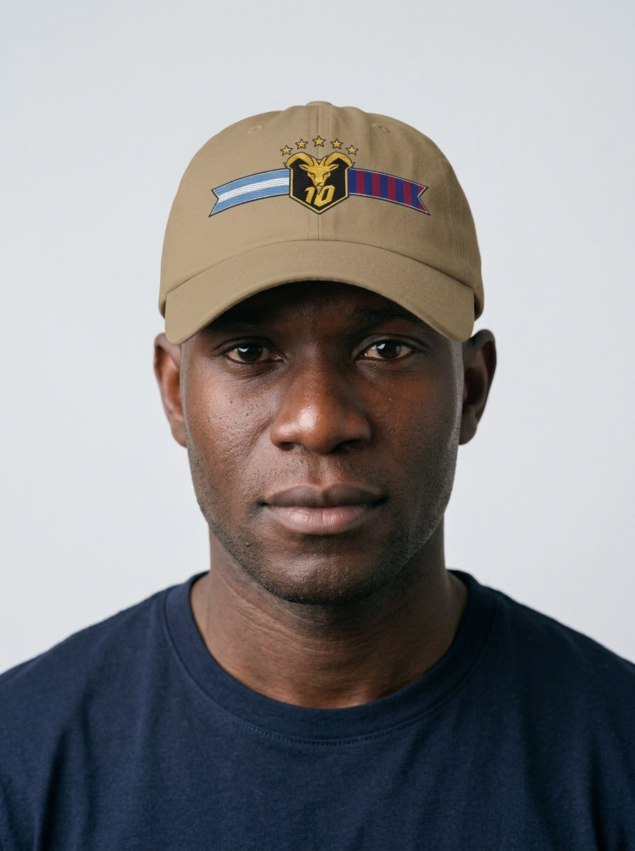 GOAT Fusión dad hat in Aja Sand, worn — the both-flags GOAT crest front and centre