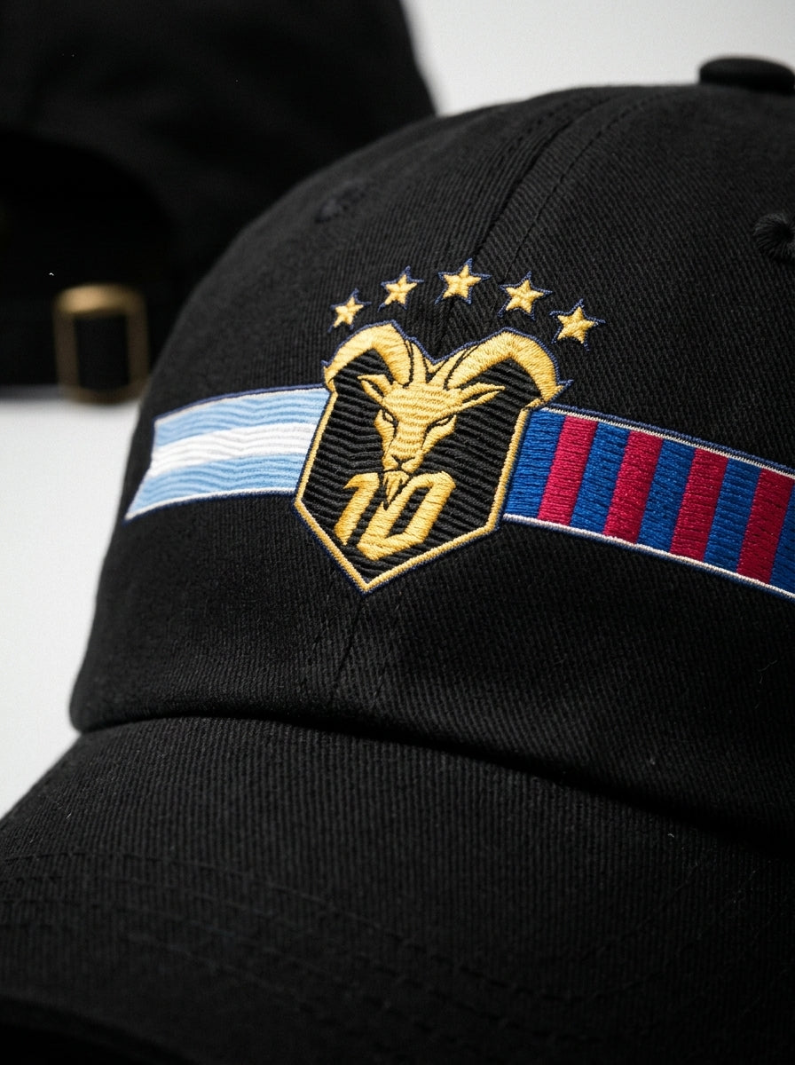 GOAT Fusión dad hat in Oji Black — macro detail of the unlimited-colour embroidered crest, split Argentina + Barça ribbon