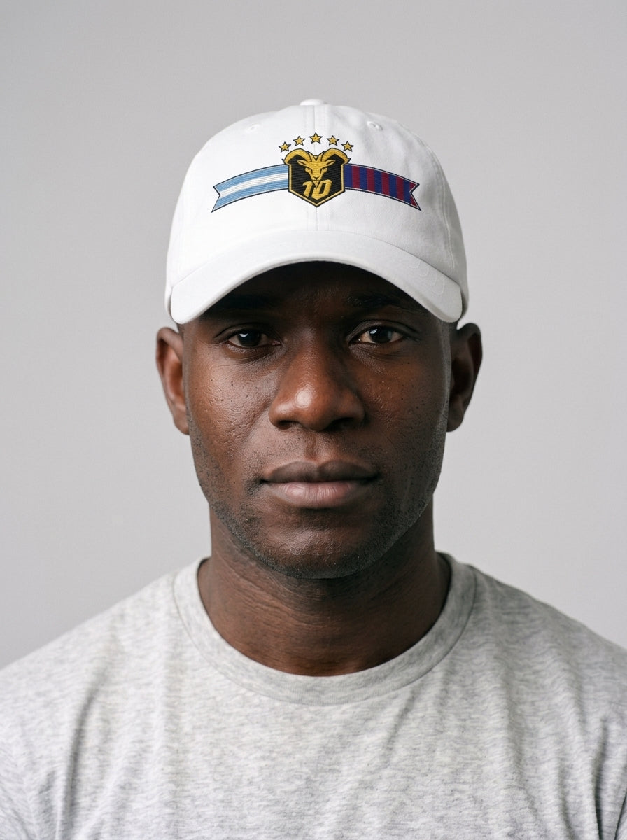 GOAT Fusión dad hat in Ocha White, worn — the both-flags GOAT crest front and centre