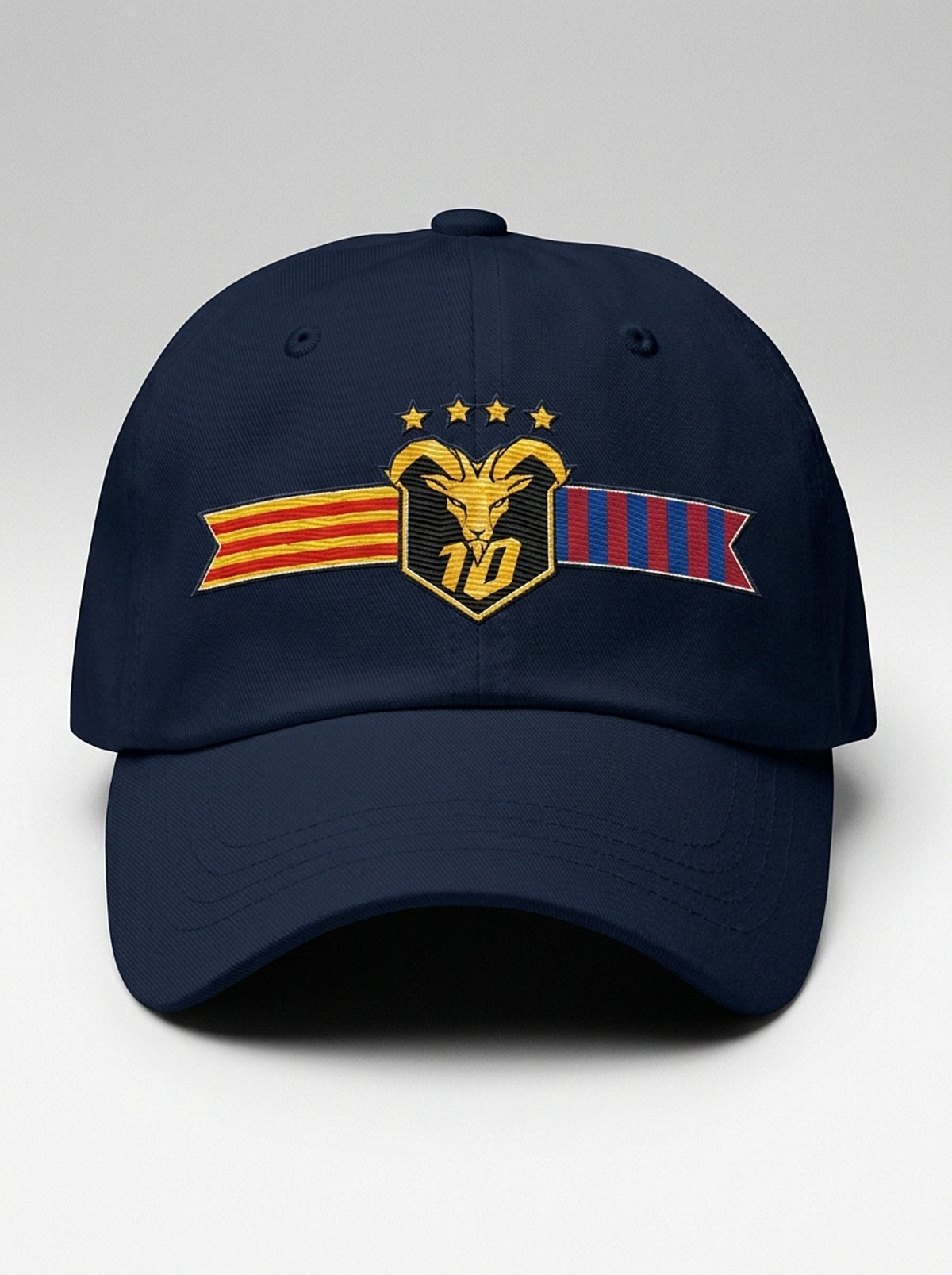 GOAT Catalan dad hat in Anụnụ Blue, front view — the full-colour Catalan crest embroidered on the crown: gold goat, No. 10, four stars, split Senyera and blaugrana banner.