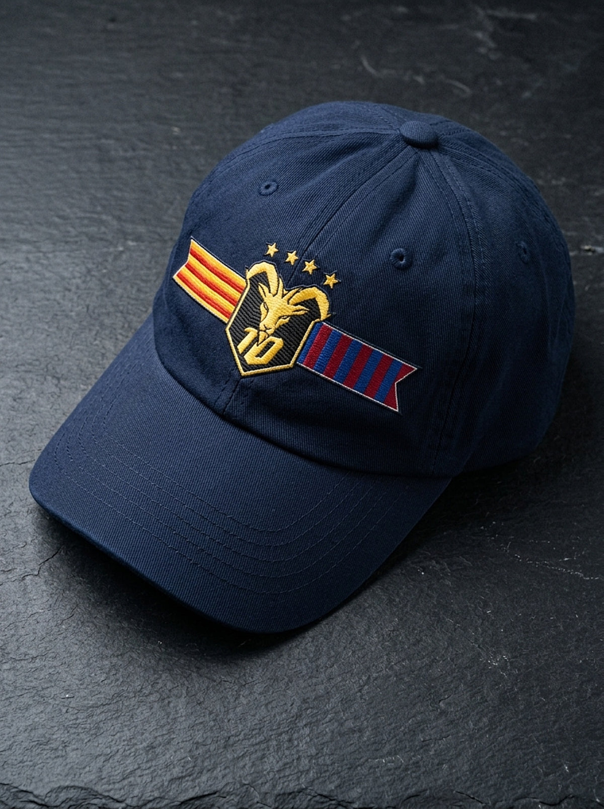GOAT Catalan dad hat in Anụnụ Blue, styled flat-lay showing the embroidered Catalan crest.