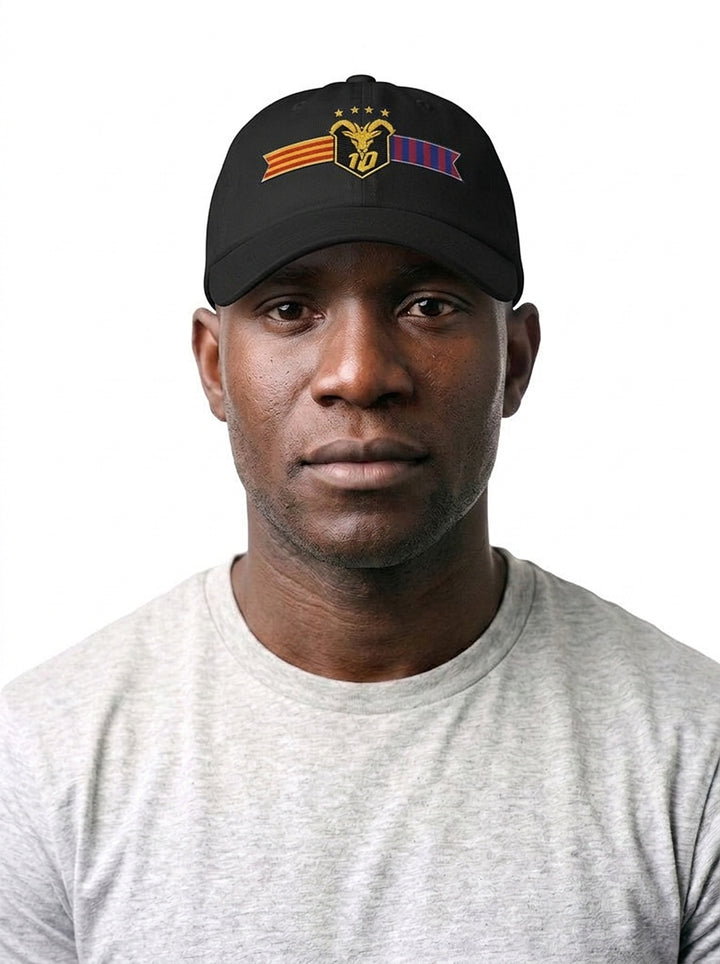 Model wearing the GOAT Catalan dad hat in Oji Black, front view, showing the embroidered Catalan crest on the low-profile crown.