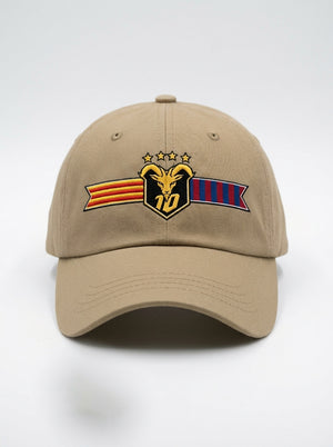 GOAT Catalan dad hat in Aja Sand, front view — the full-colour Catalan crest embroidered on the crown: gold goat, No. 10, four stars, split Senyera and blaugrana banner.