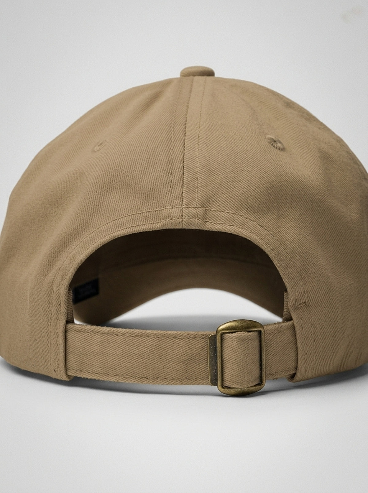 GOAT Catalan dad hat in Aja Sand, back view — adjustable strap with antique buckle.