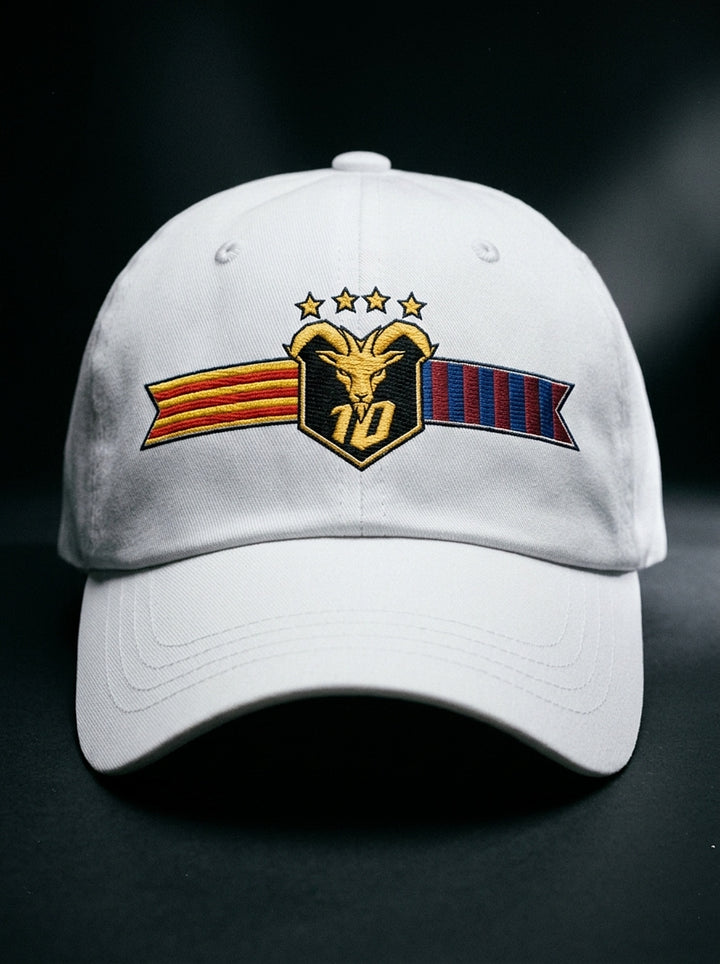GOAT Catalan dad hat in Ocha White, front view — the full-colour Catalan crest embroidered on the crown: gold goat, No. 10, four stars, split Senyera and blaugrana banner.