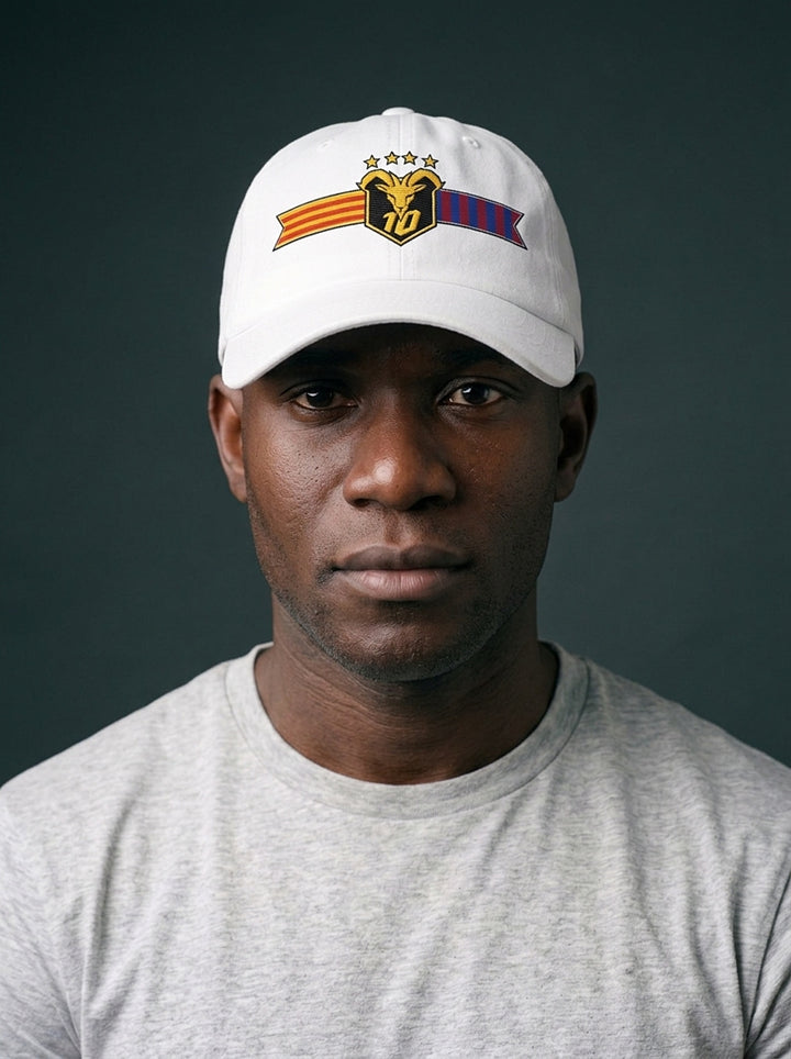 Model wearing the GOAT Catalan dad hat in Ocha White, front view, showing the embroidered Catalan crest on the low-profile crown.