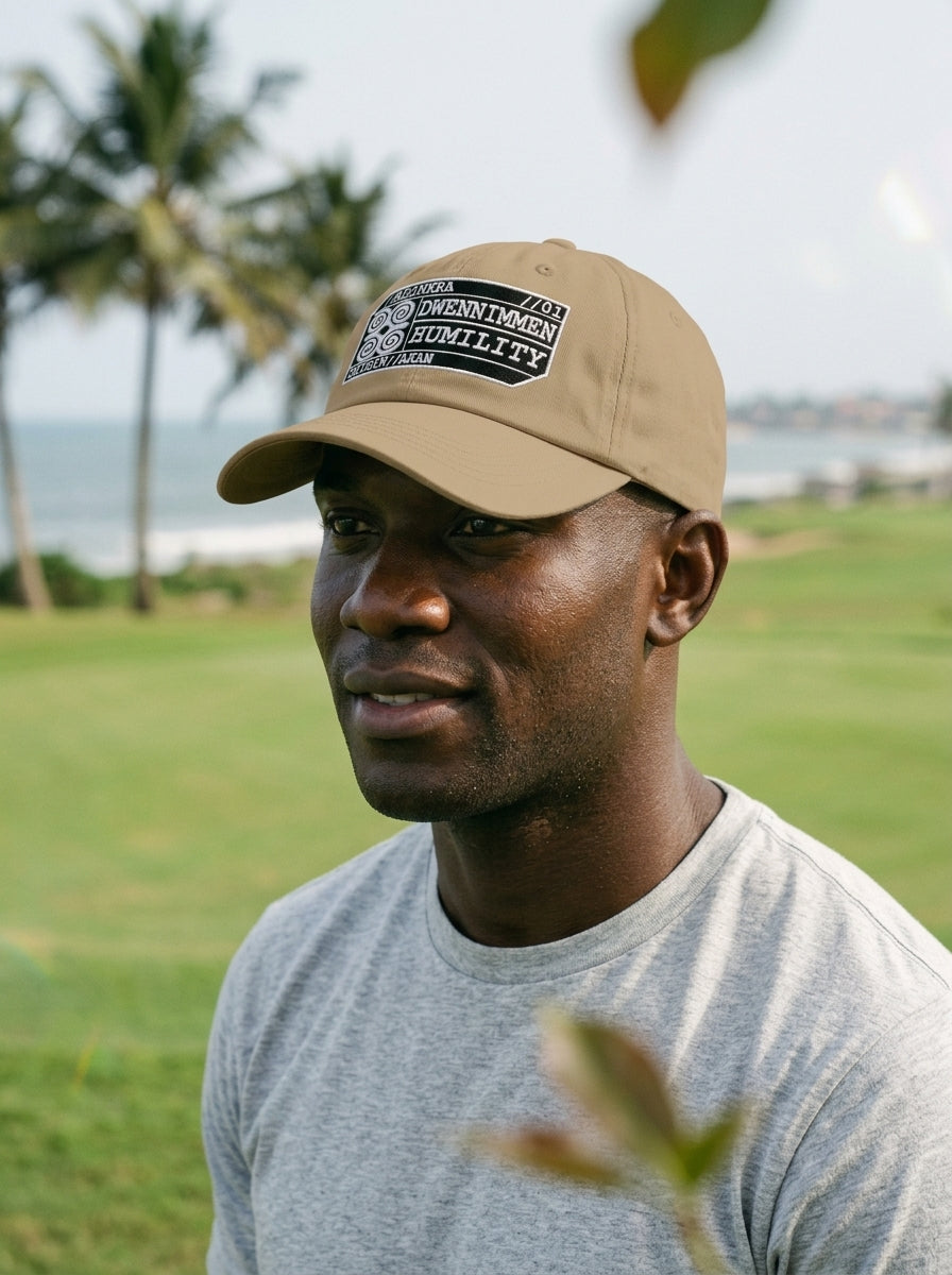 Adinkra Humility Dad Hat in Aja Sand — editorial styled fit