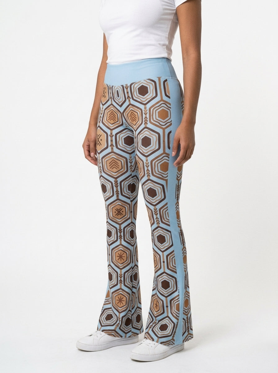 AnanseNova™ Flare Leggings in Igwe Blue™, three-quarter angle left — SunBorn
