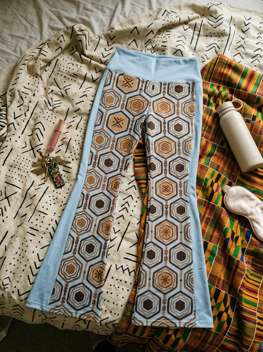 AnanseNova™ Flare Leggings in Igwe Blue™, styled flat lay — SunBorn