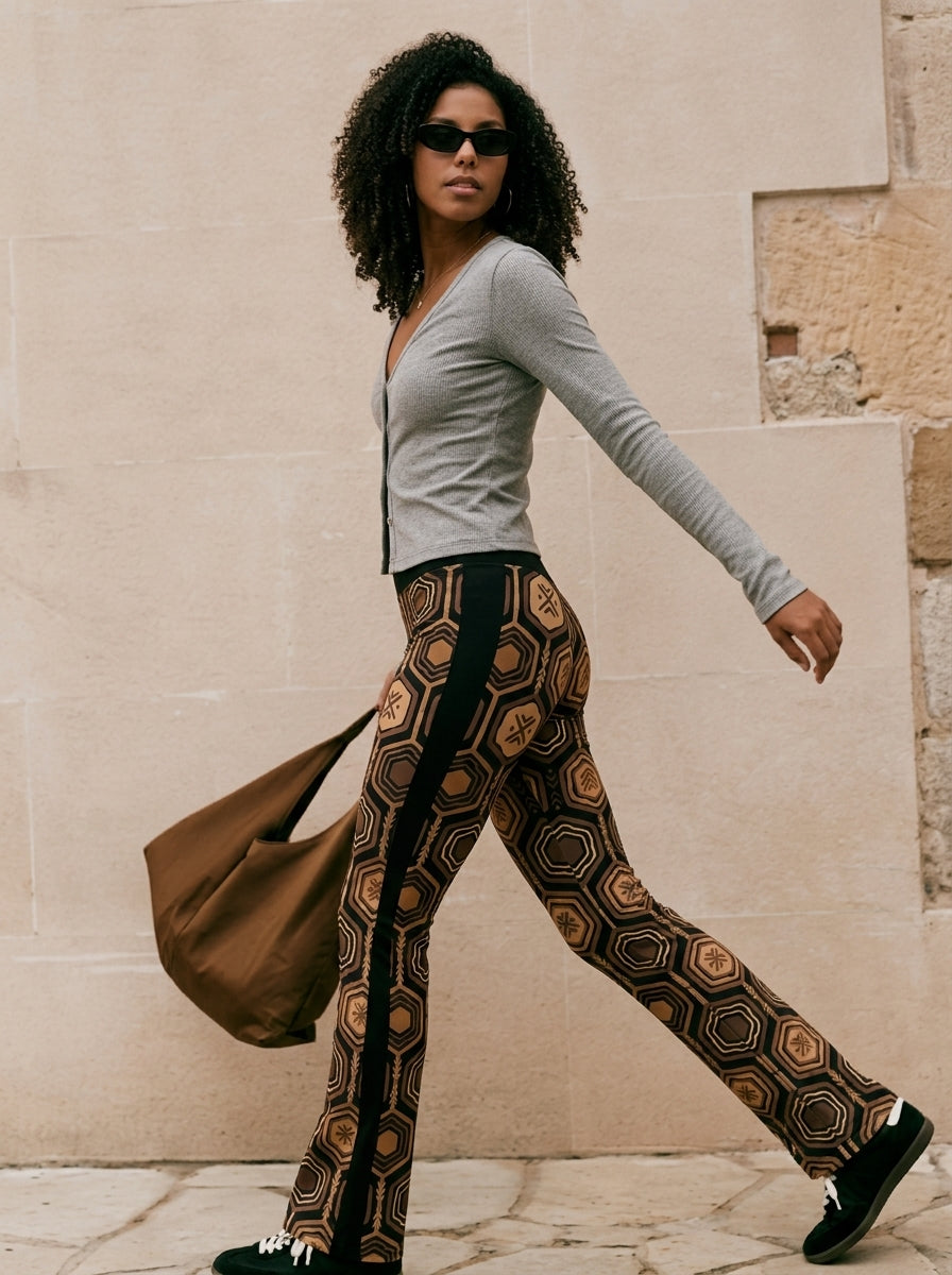 AnanseNova™ Flare Leggings in Oji Black, lifestyle candid shot alt — SunBorn