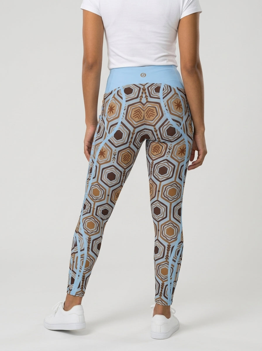 AnanseNova™ Pocket Leggings in Igwe Blue, back view on model showing the high waistband and hexagon print