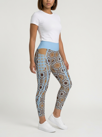 AnanseNova™ Pocket Leggings in Igwe Blue, three-quarter right view on model — hexagon web-cell print with side pocket