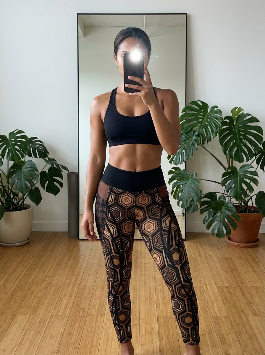 Pilates studio selfie in the AnanseNova™ Pocket Leggings in Oji Black