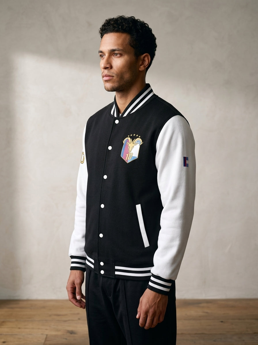 GOAT // Fusión Letterman Jacket in Jet Black/Arctic White, three-quarter left