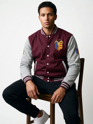 GOAT // Catalan Letterman Jacket in burgundy and heather grey, front view — gold Senyera crest on the left chest.