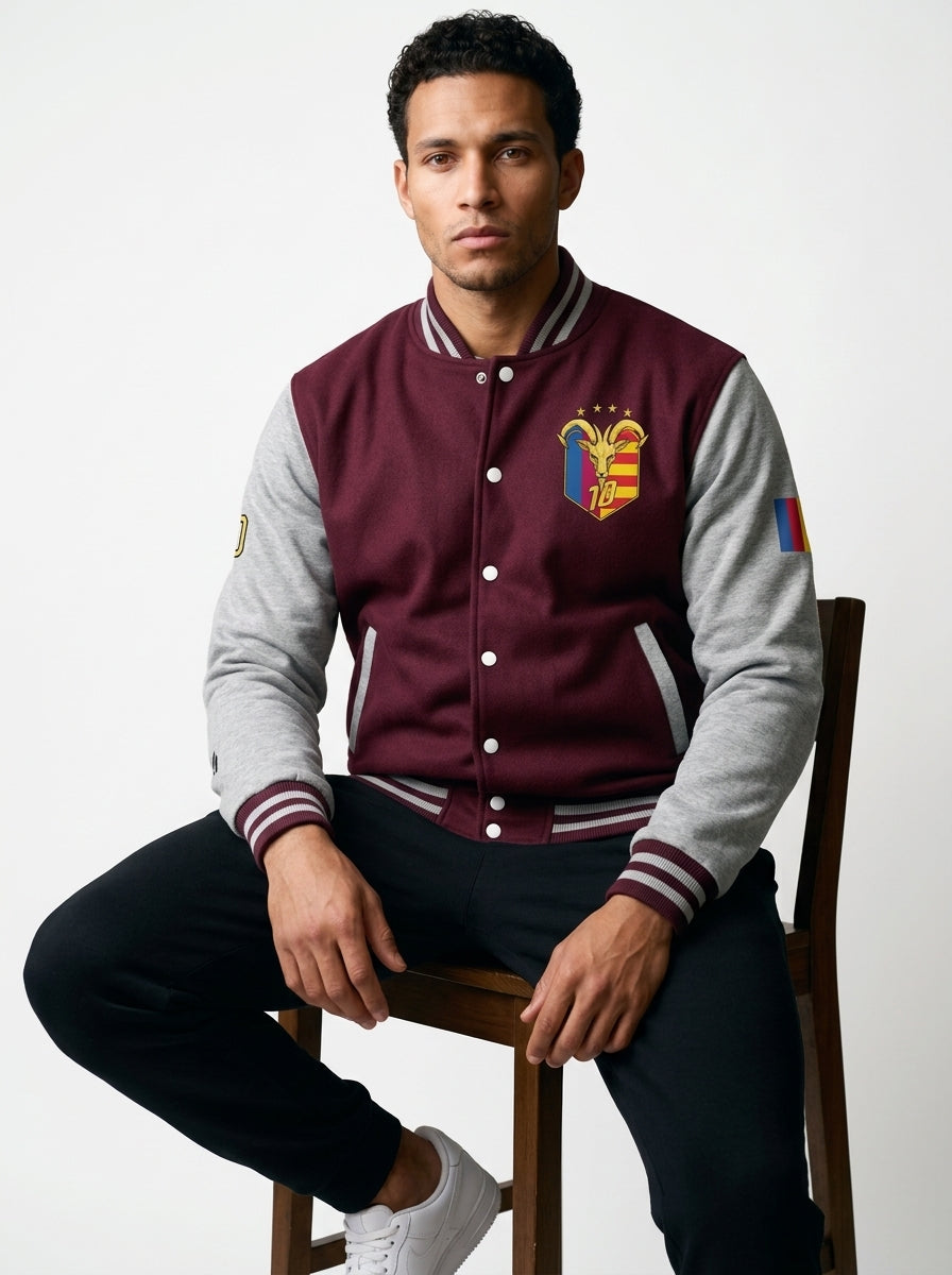 GOAT // Catalan Letterman Jacket in burgundy and heather grey, front view — gold Senyera crest on the left chest.