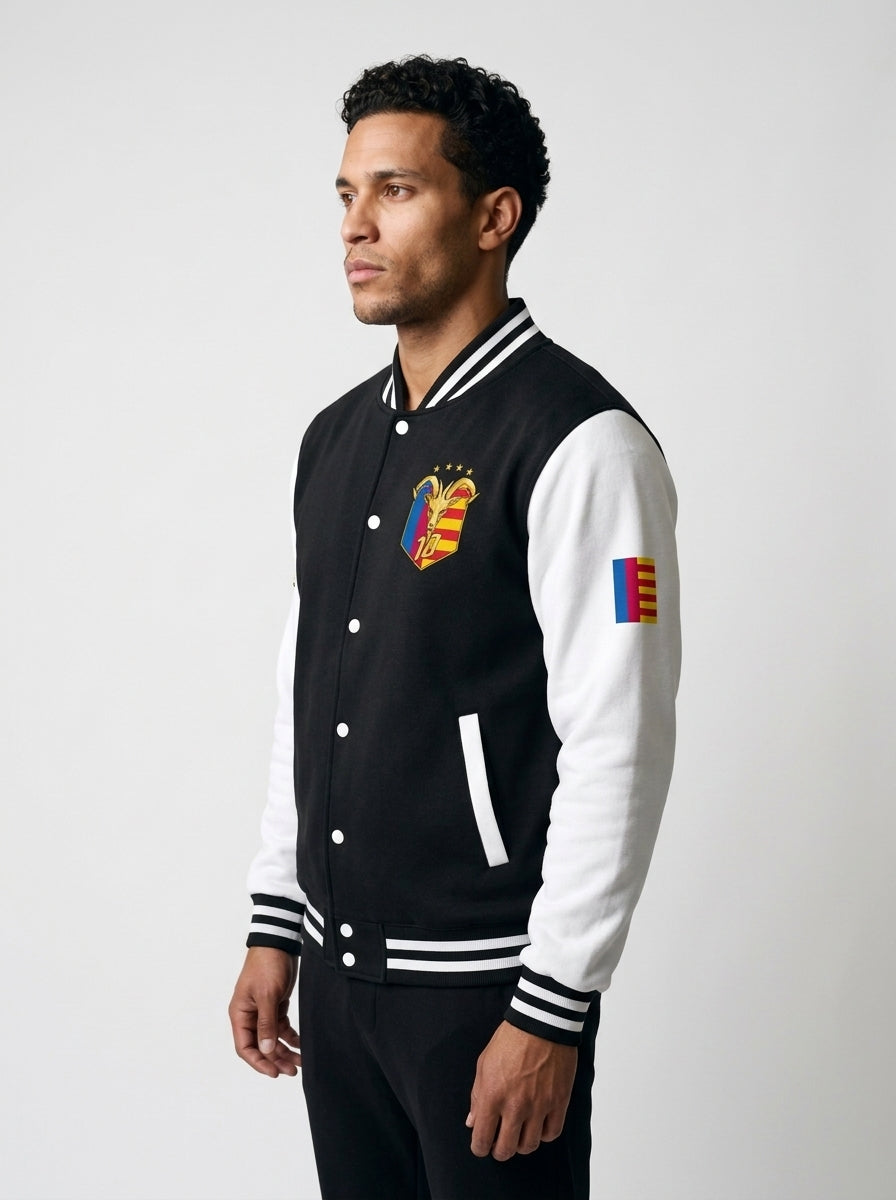 GOAT // Catalan Letterman Jacket in jet black, three-quarter left view.