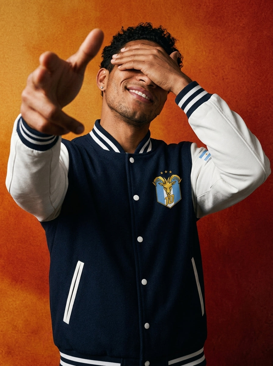 Lifestyle shot — GOAT // Celeste Letterman Jacket in Oxford Navy / Arctic White, styled on the street.