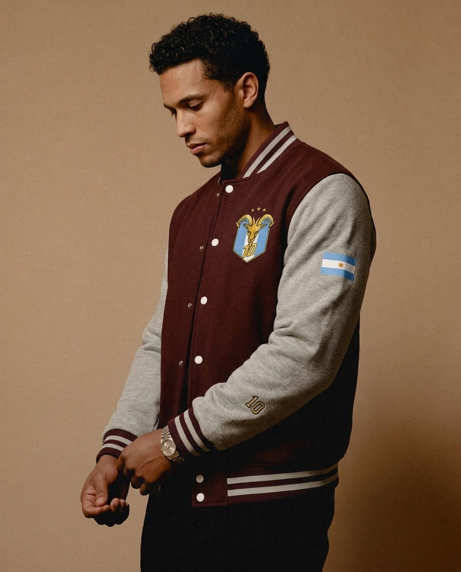 Lifestyle shot — GOAT // Celeste Letterman Jacket in Burgundy / Heather Grey, styled on the street.