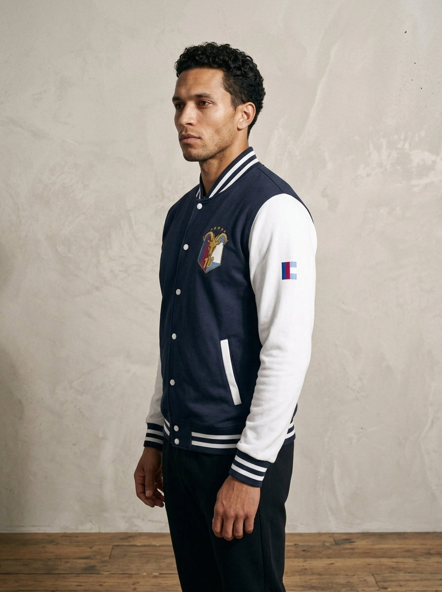 GOAT // Fusión Letterman Jacket in Oxford Navy/Arctic White, three-quarter left