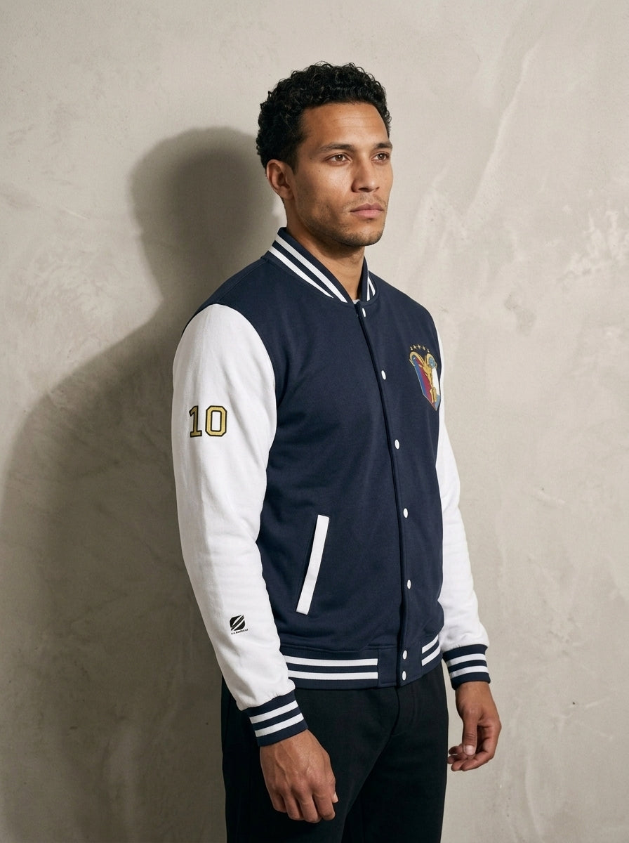 GOAT // Fusión Letterman Jacket in Oxford Navy/Arctic White, three-quarter right