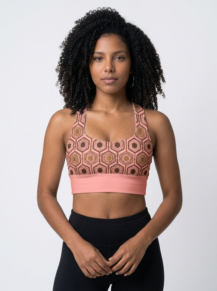 AnanseNova™ Longline Sports Bra in Adaeze Pink, studio front view — SunBorn