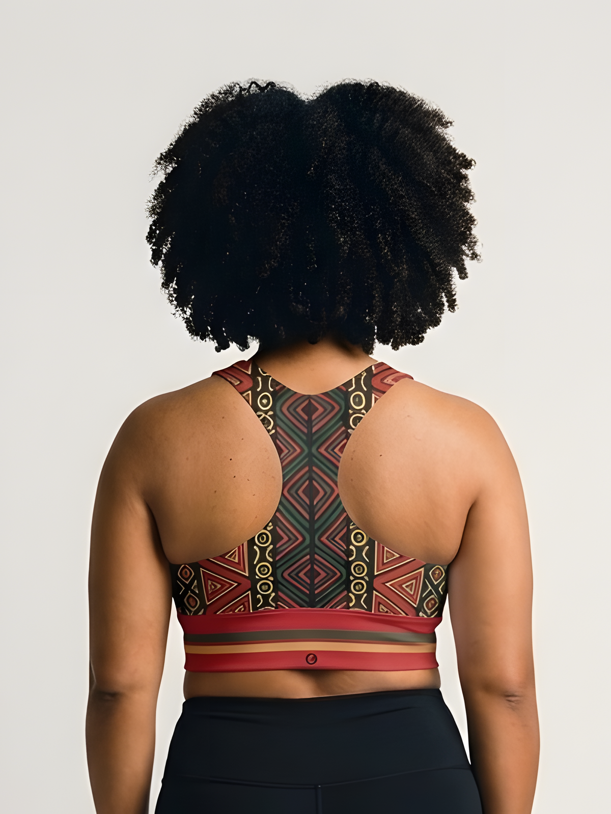 N'Donso™ Longline Sports Bra in Uhie Red, back view — Hunter's Road print across the back, double-layered straps.