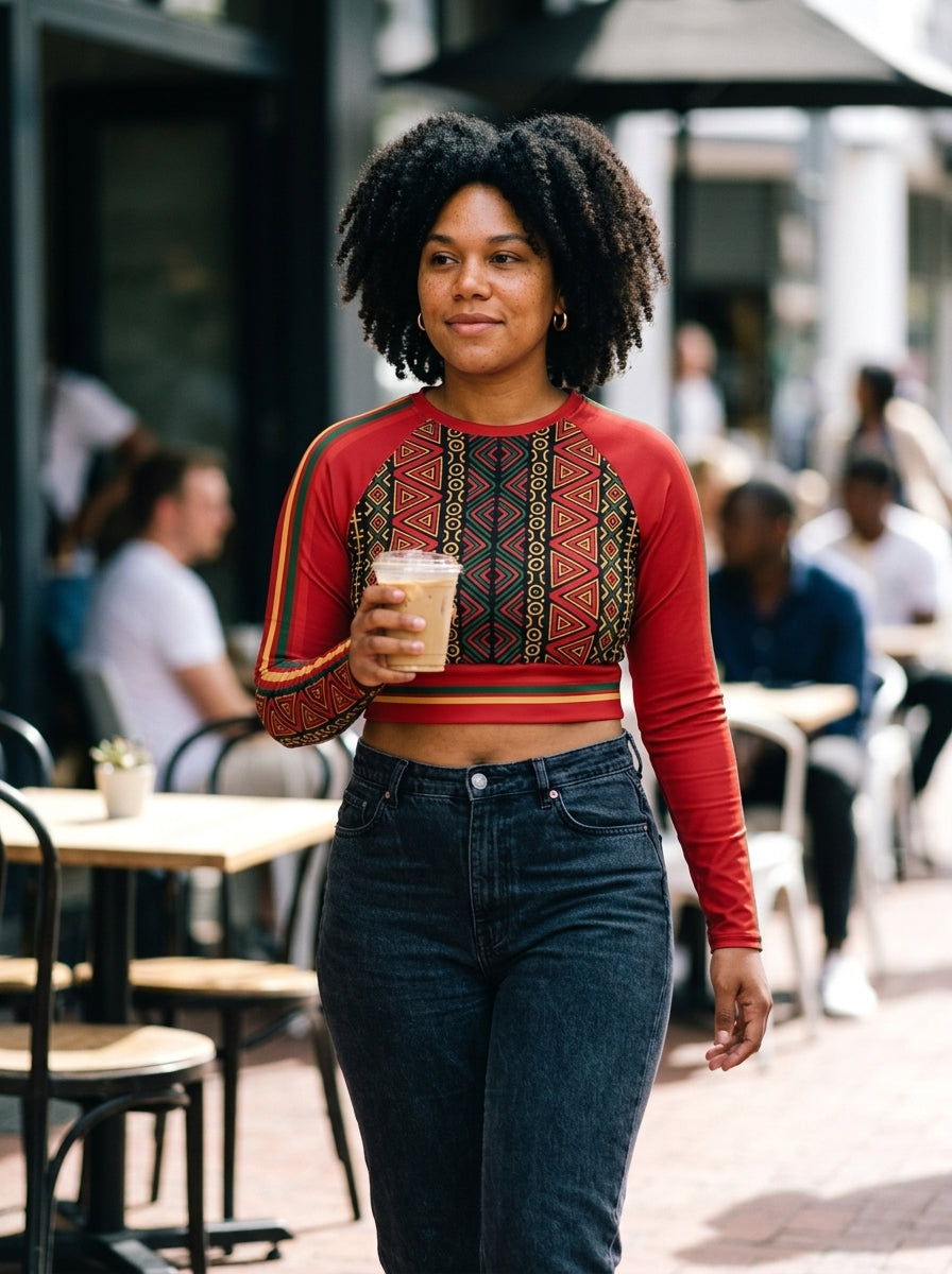 Street-style shot of the N'Donso™ Long Sleeve Crop in Uhie Red, worn on the move