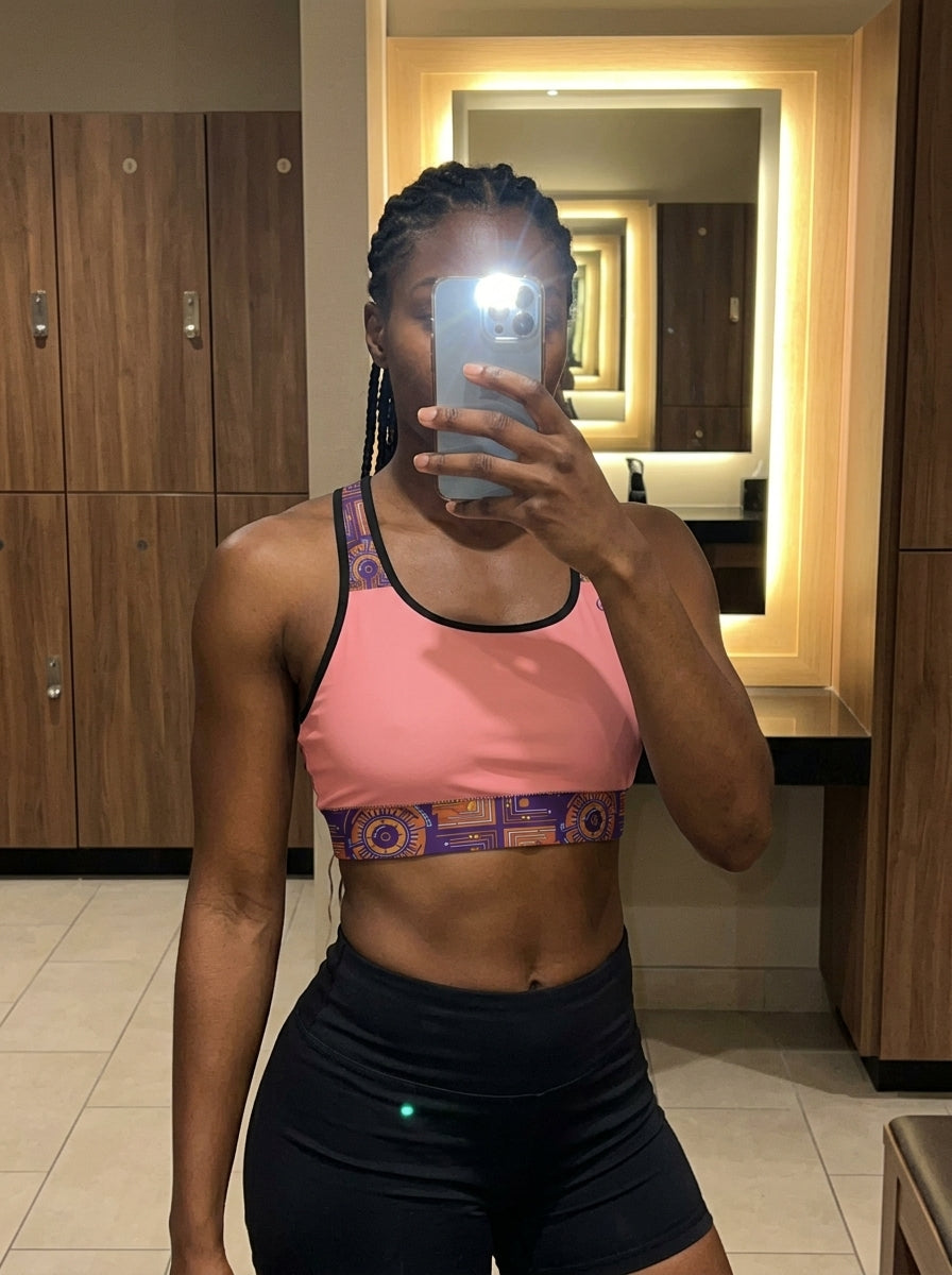 Sankofa Padded Sports Bra in the Adaeze Pink Kinetic Engine print, UGC mirror selfie in gym locker room — SunBorn